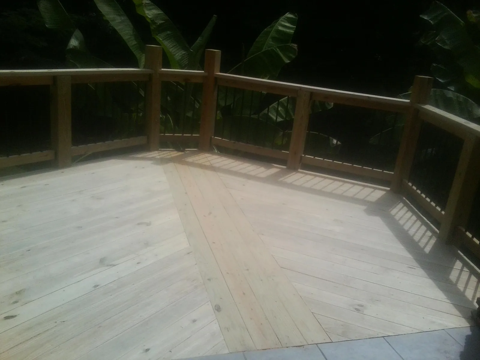 New wood deck and railing built off the back of a home in Chester